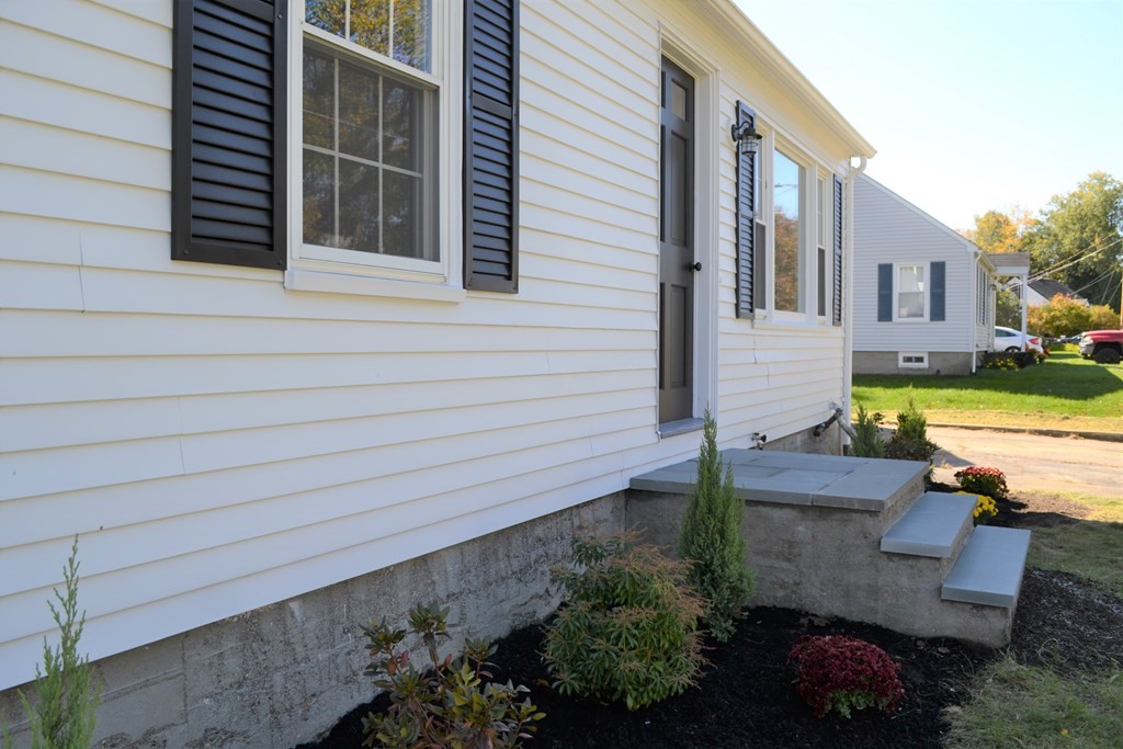 31 Highland Park Road Rutland, MA 01543 - Photo 3 of 21 a view of a patio with chair and table and chairs and wooden fence