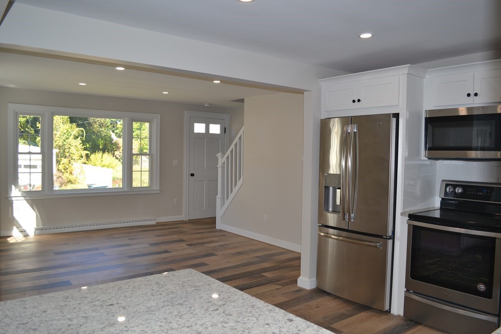 31 Highland Park Road Rutland, MA 01543 - Photo 9 of 21 a kitchen with stainless steel appliances a refrigerator and a stove top oven