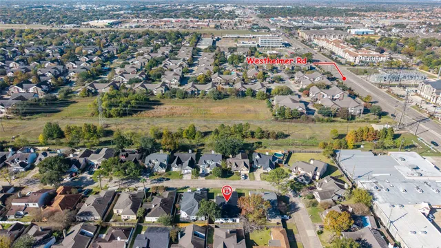 an aerial view of a city with lots of residential buildings