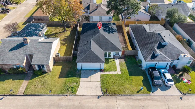 an aerial view of a house with swimming pool