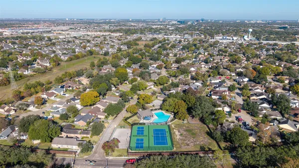 an aerial view of a house with outdoor space