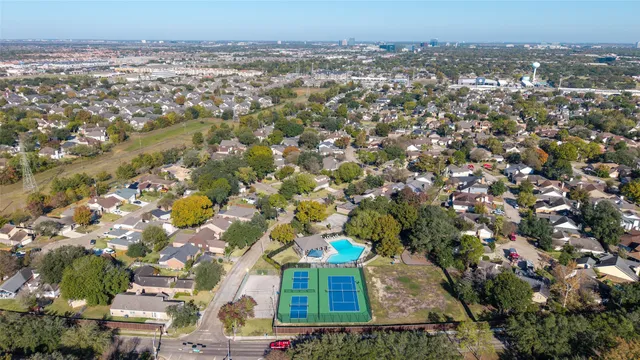 an aerial view of a house with outdoor space