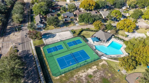 an aerial view of a house with a garden and swimming pool