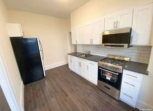 a kitchen with a stove and a microwave