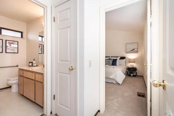 a en suite bathroom with a sink and a mirror