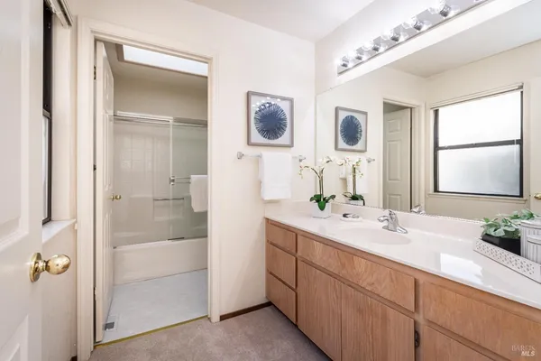 a bathroom with a double vanity sink mirror and double