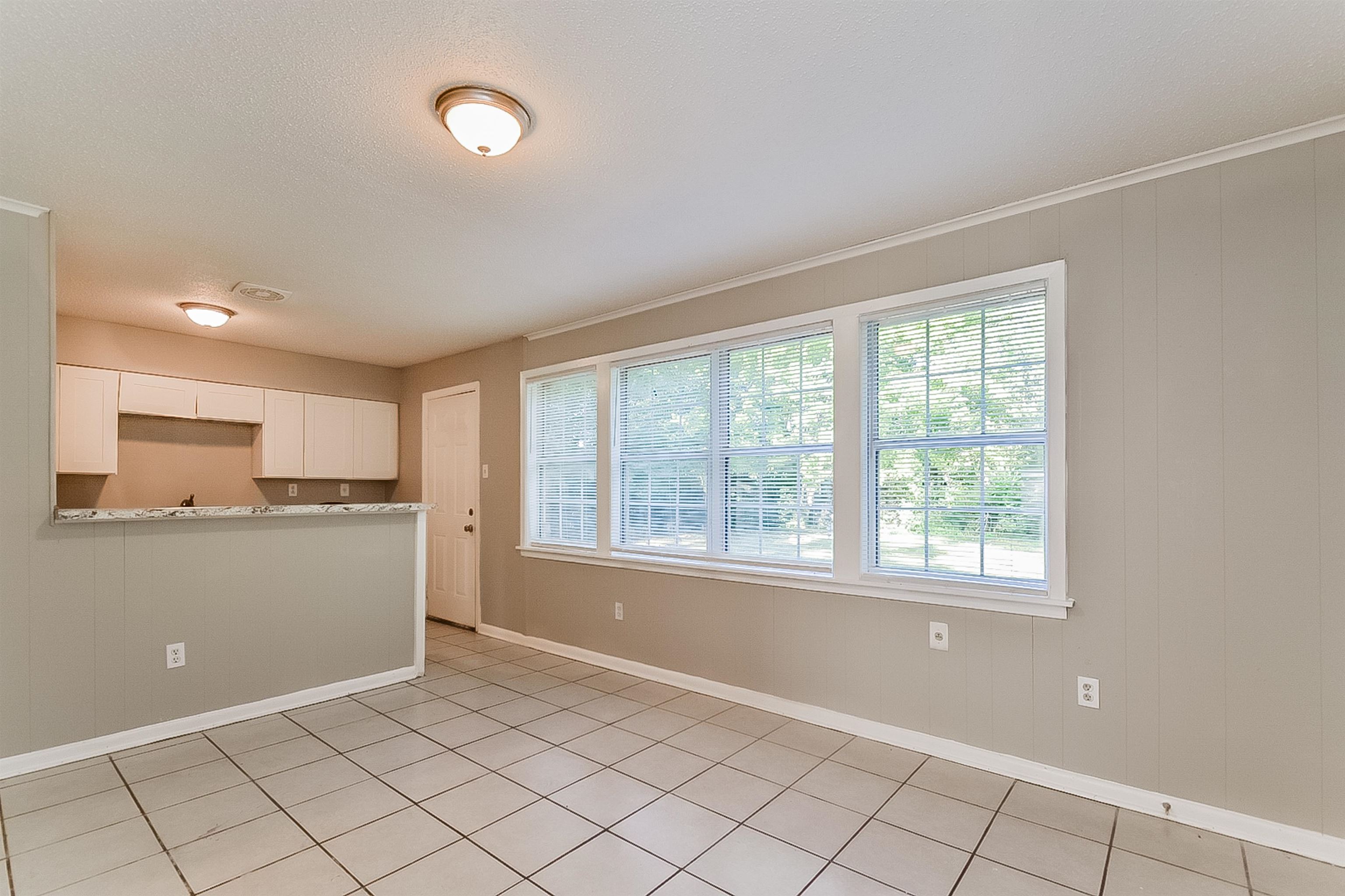 3020 Capri Road Memphis, TN 38118 - Photo 3 of 14 Kitchen featuring white cabinets and light countertops
