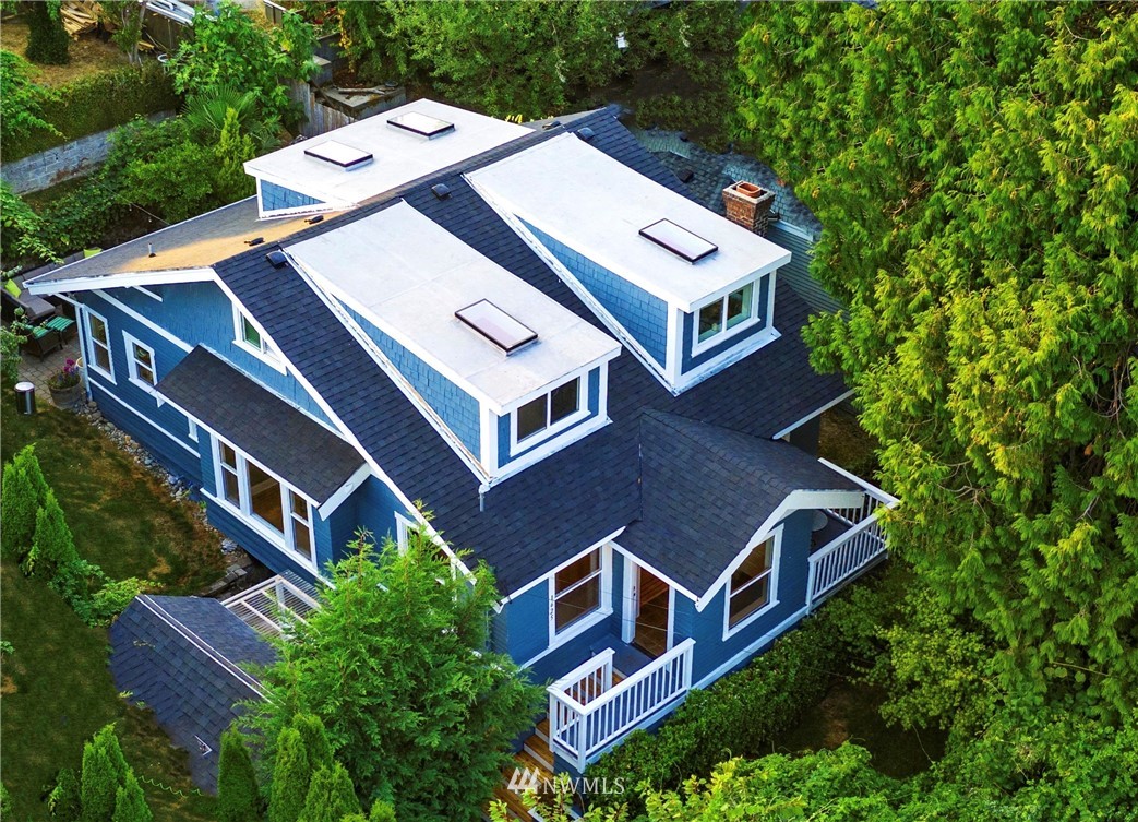 1625 27th Avenue Seattle, WA 98122 - Photo 1 of 40 an aerial view of a house with balcony and trees al around