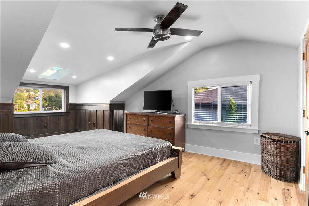 1625 27th Avenue Seattle, WA 98122 - Photo 23 of 40 a bedroom with a bed and a flat screen tv