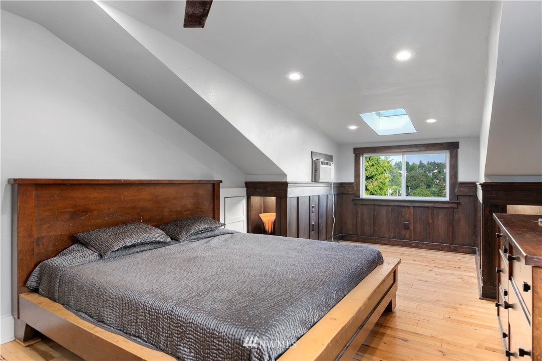 1625 27th Avenue Seattle, WA 98122 - Photo 24 of 40 a bedroom with a large bed and a large window
