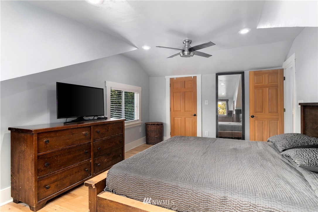 1625 27th Avenue Seattle, WA 98122 - Photo 26 of 40 a bedroom with a bed and a flat screen tv