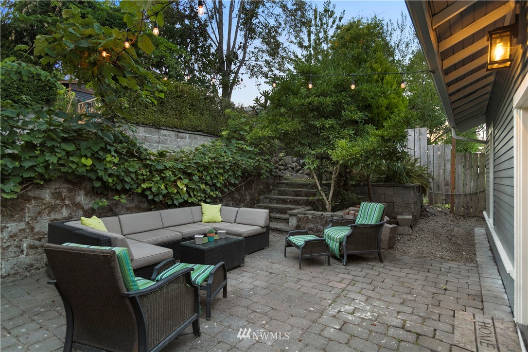 1625 27th Avenue Seattle, WA 98122 - Photo 36 of 40 a view of a patio with couches chairs and a fire pit