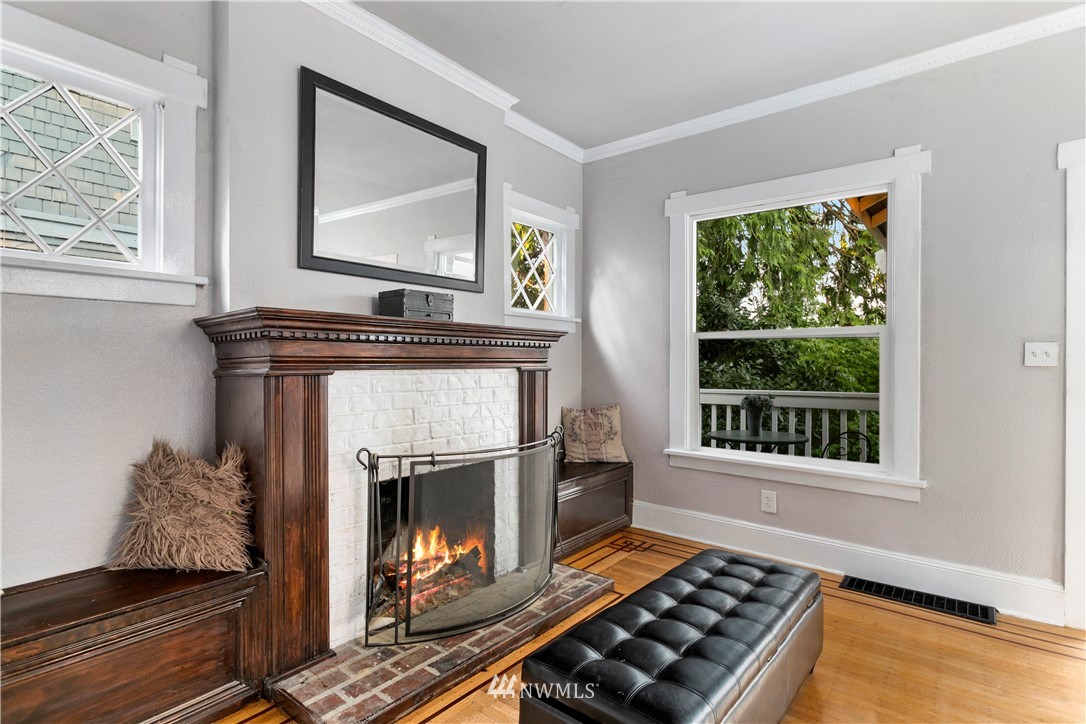 1625 27th Avenue Seattle, WA 98122 - Photo 9 of 40 a living room with furniture and a fireplace