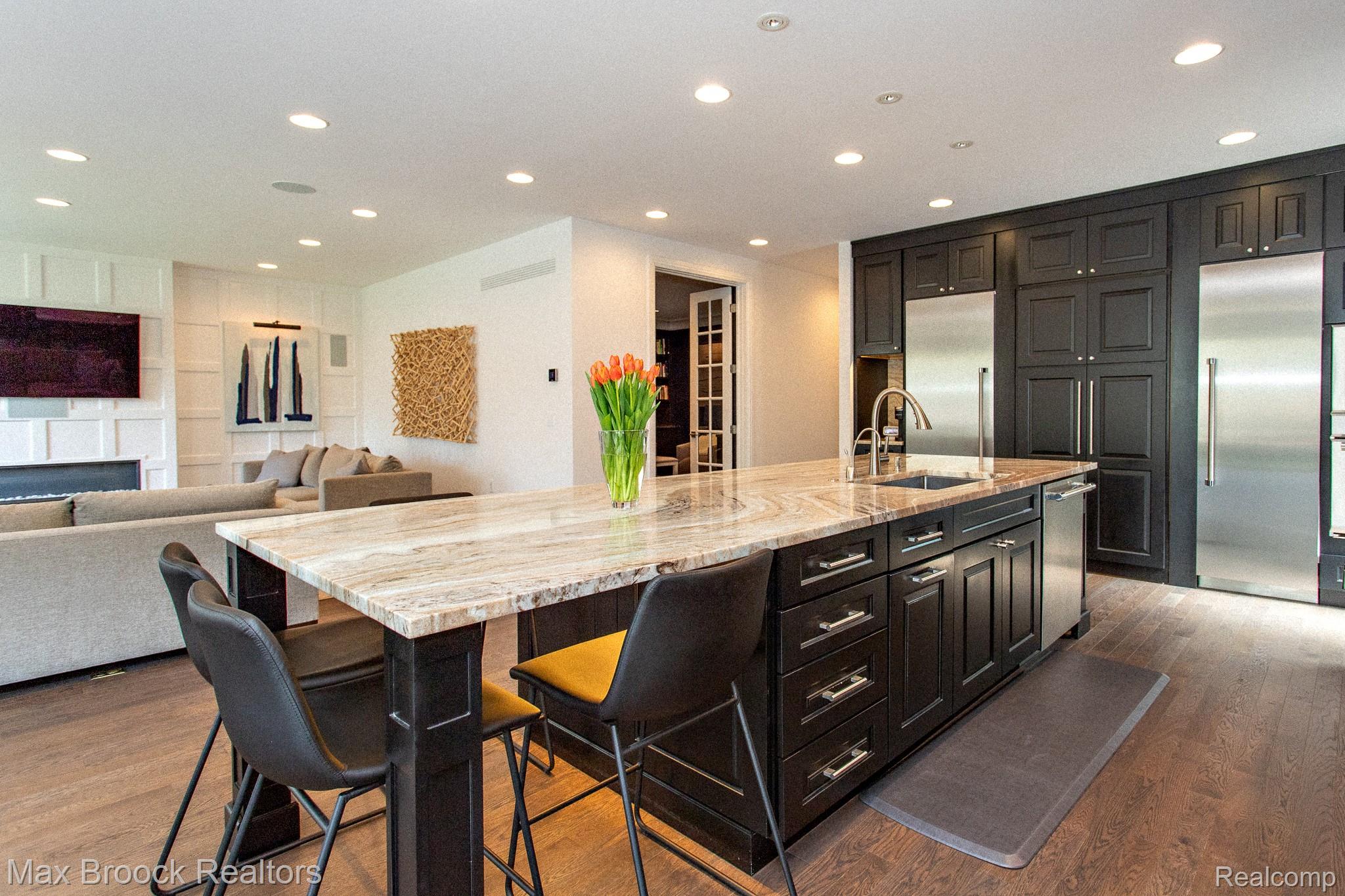 25925 York Road Royal Oak, MI 48067 - Photo 88 of 88 Kitchen featuring a spacious island, light stone countertops, open floor plan, a kitchen bar, and stainless steel appliances