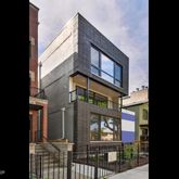 a view of a large building with a tree