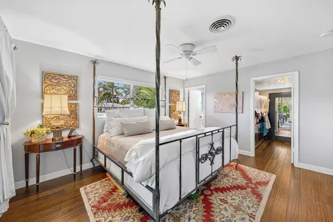 a bed room with furniture and a window