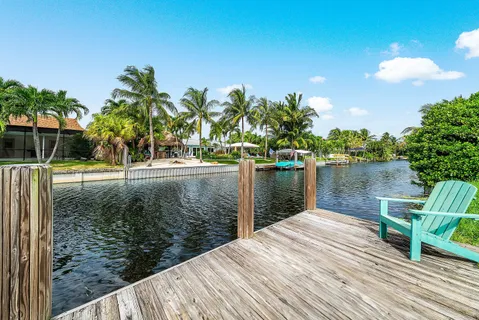 an aerial view of residential houses with outdoor space and street view