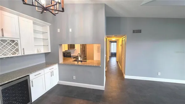 a view of a kitchen cabinets and wooden floor