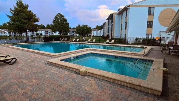 swimming pool with outdoor seating and yard