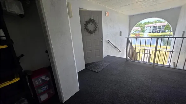 a view of hall way with furniture