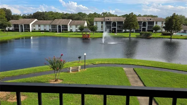 a view of a lake with houses in front of it