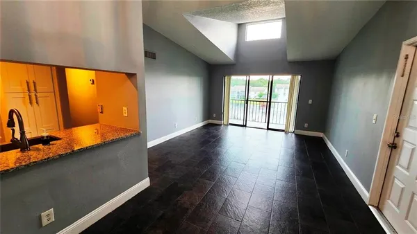 a view of entryway with wooden floor and fan