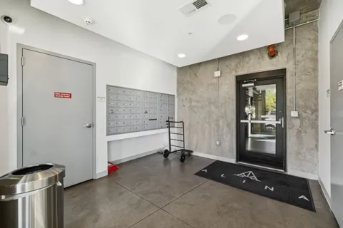 a room with gym equipment and large mirror