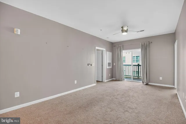 a view of kitchen and kitchen with stainless steel appliances