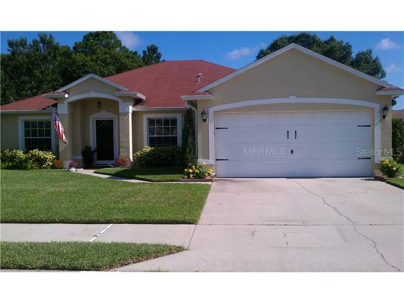 1119 Jay Place Melbourne, FL 32940 - Photo 1 of 1 a front view of a house with a yard and garage
