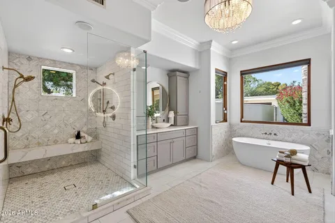 a bathroom with a sink vanity and a mirror