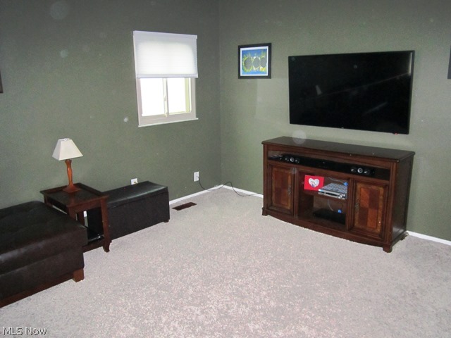 First level living room with neutral decor.