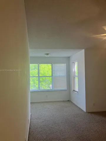 a bathroom with a granite countertop sink and vanity