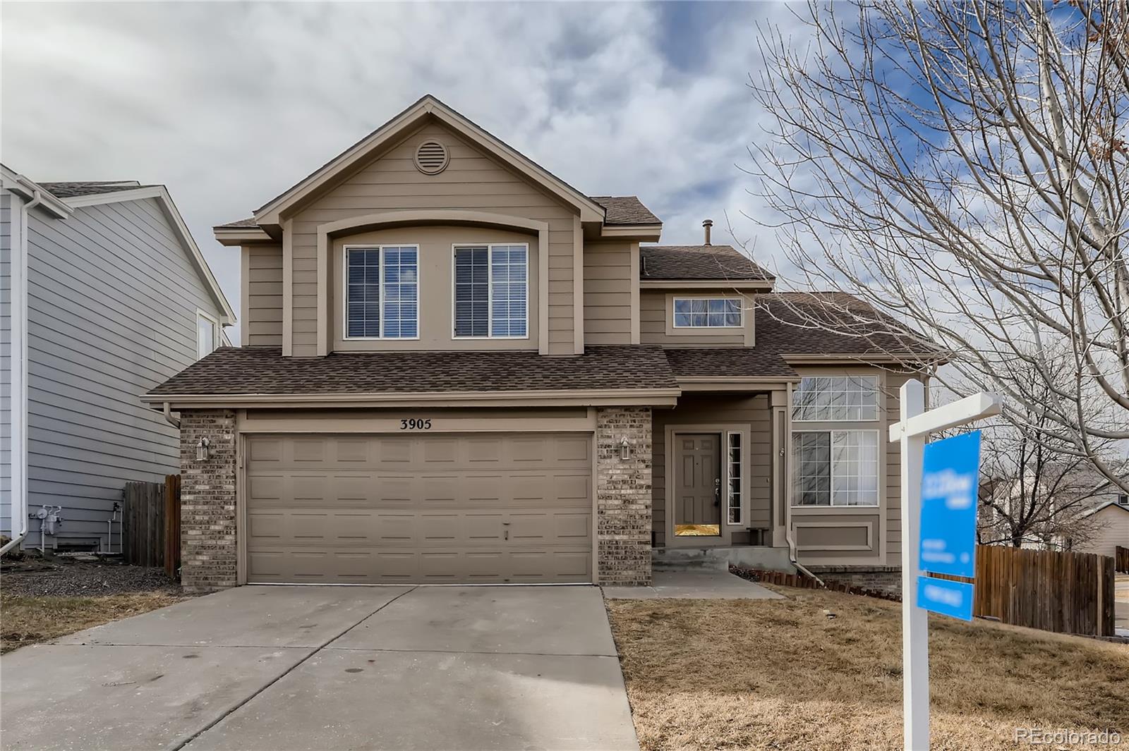 a front view of a house with garage