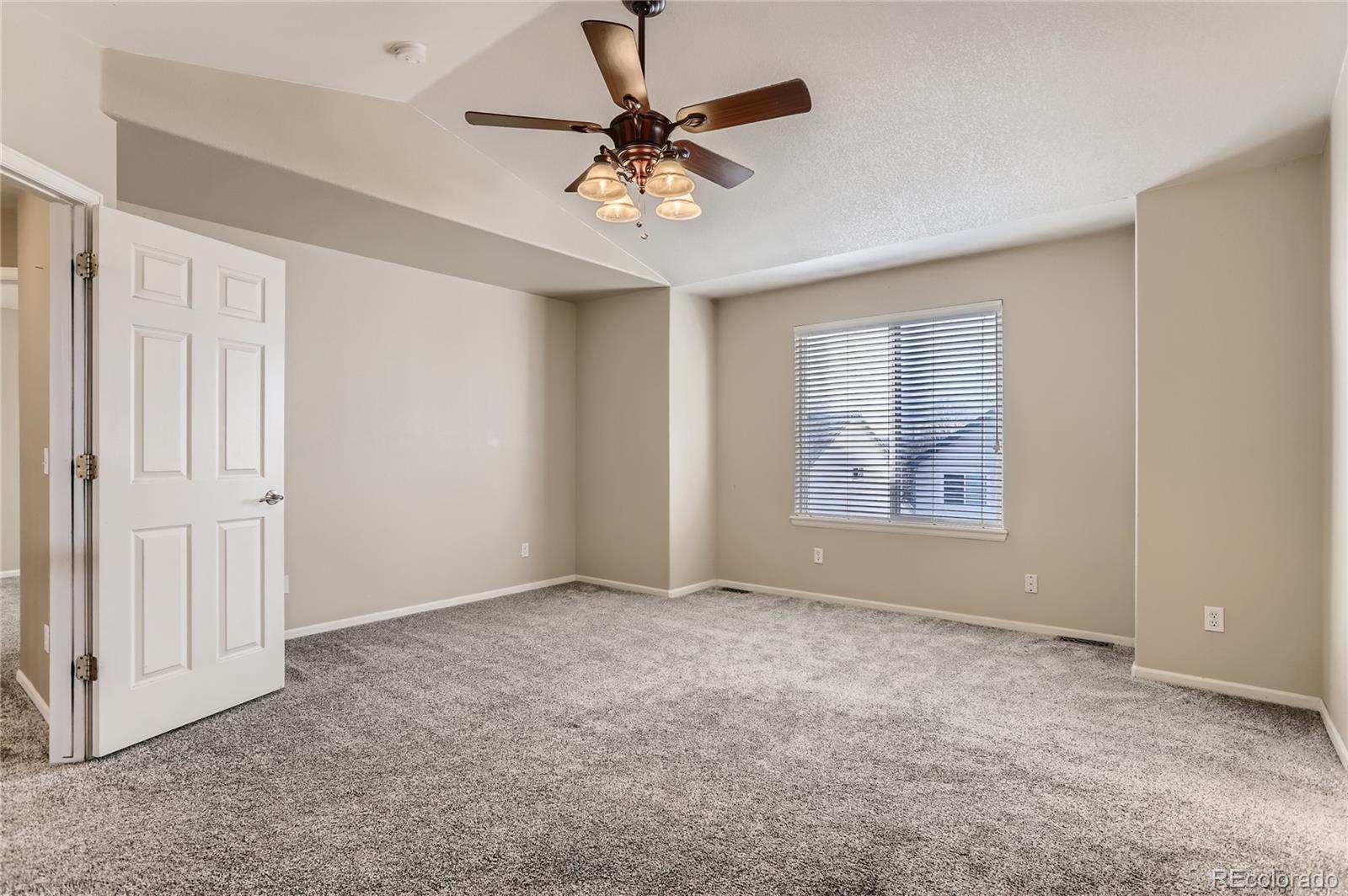 3905 South Kirk Way Aurora, CO 80013 - Photo 15 of 33 a view of an empty room with a window