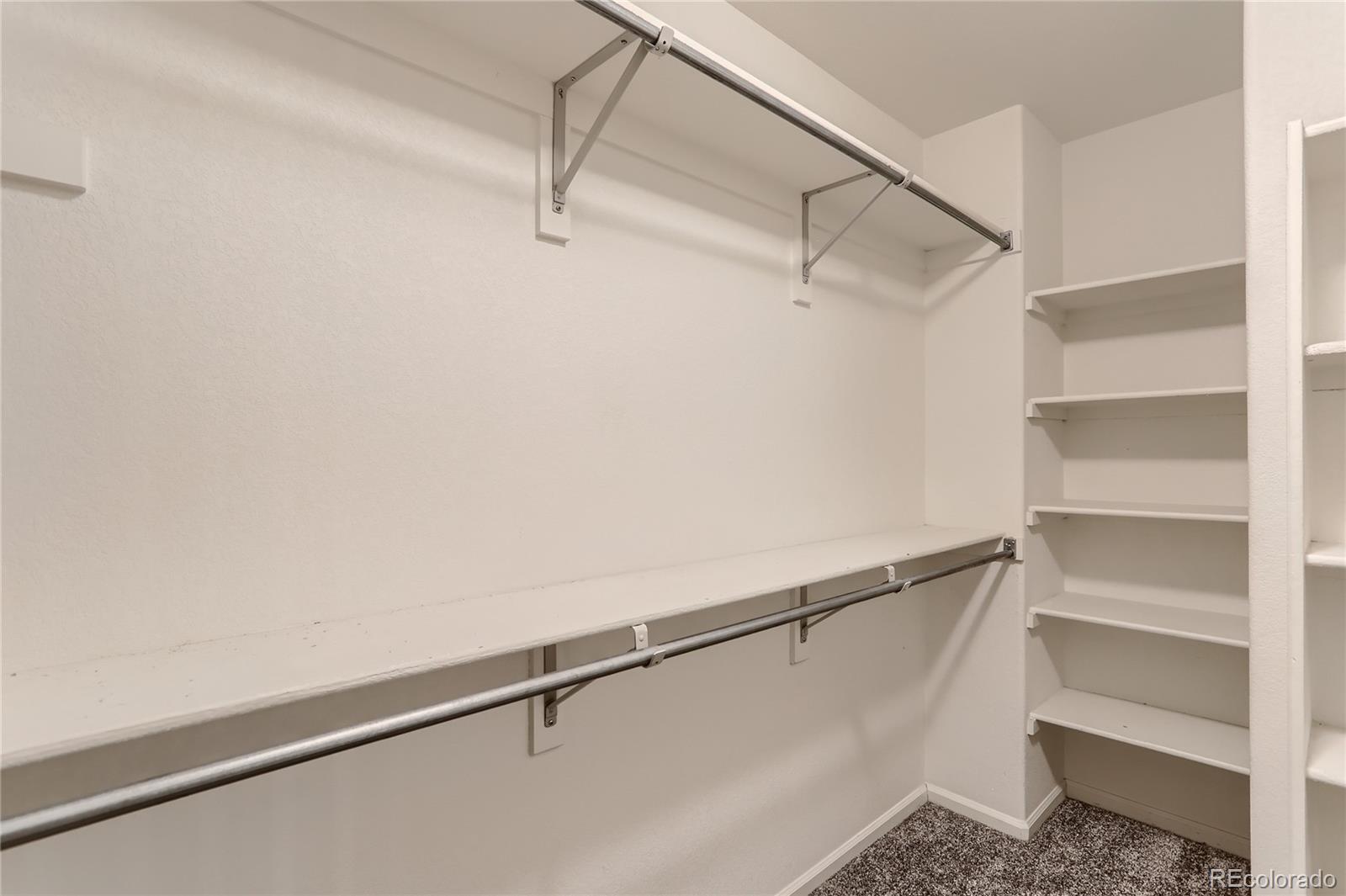 3905 South Kirk Way Aurora, CO 80013 - Photo 18 of 33 a view of an empty walk in closet