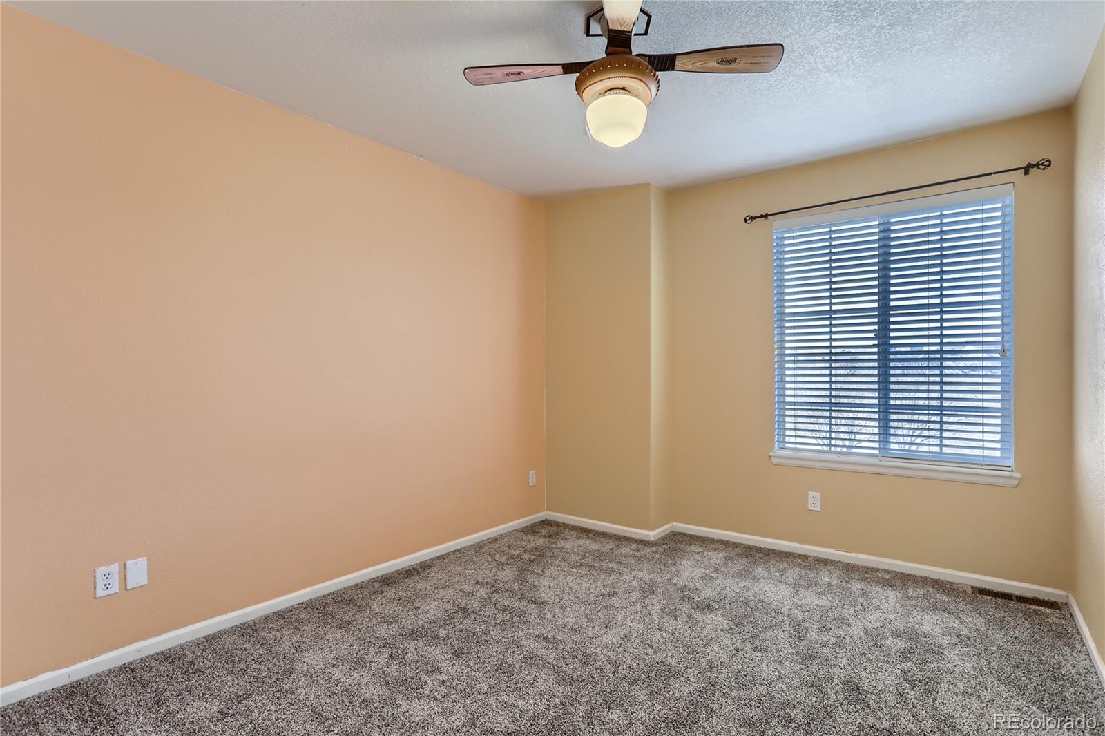 3905 South Kirk Way Aurora, CO 80013 - Photo 20 of 33 an empty room with a window