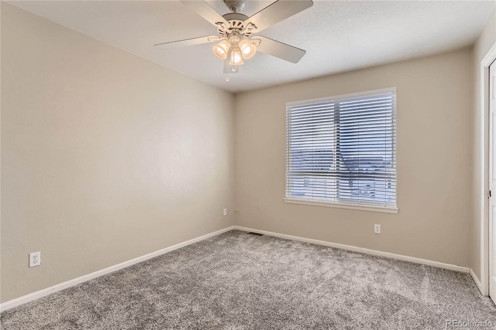3905 South Kirk Way Aurora, CO 80013 - Photo 21 of 33 a view of an empty room with a window