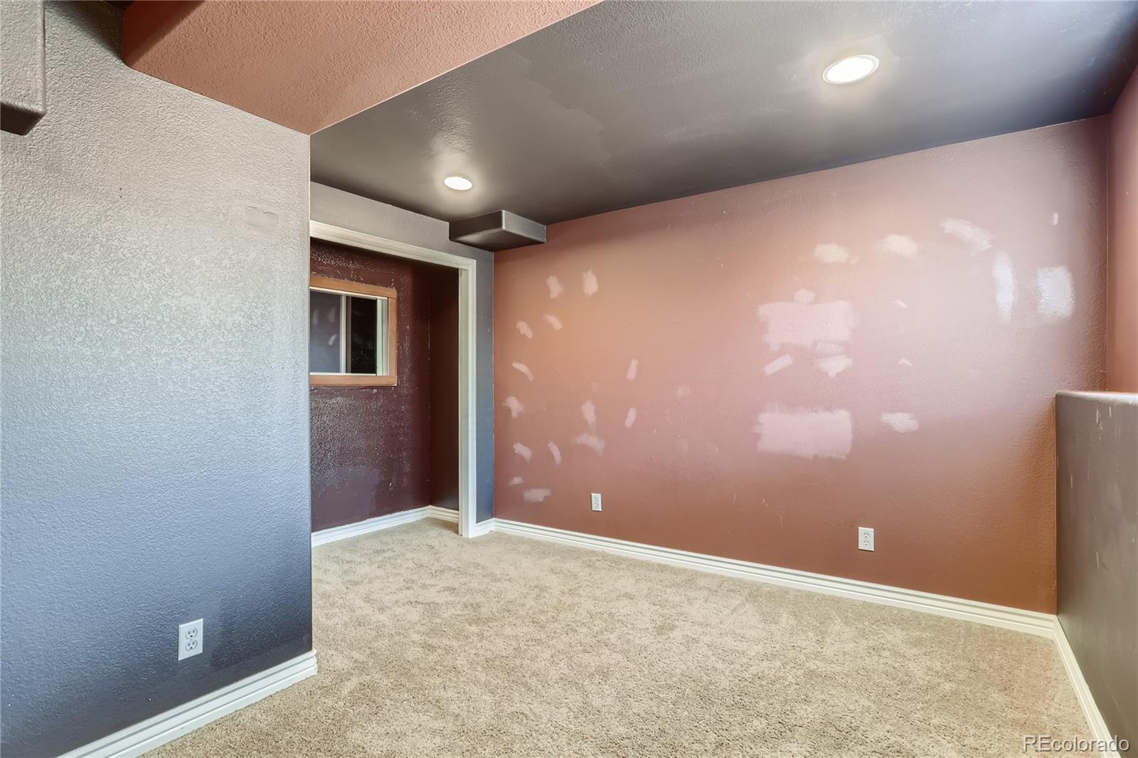 3905 South Kirk Way Aurora, CO 80013 - Photo 24 of 33 an empty room with closet and windows