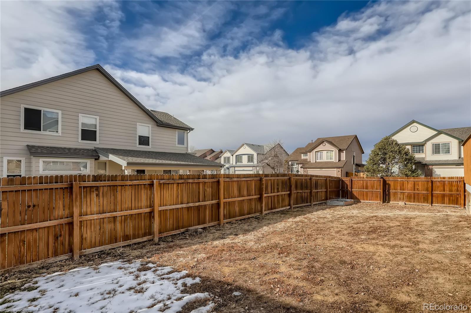 3905 South Kirk Way Aurora, CO 80013 - Photo 30 of 33 a view of a house with wooden fence