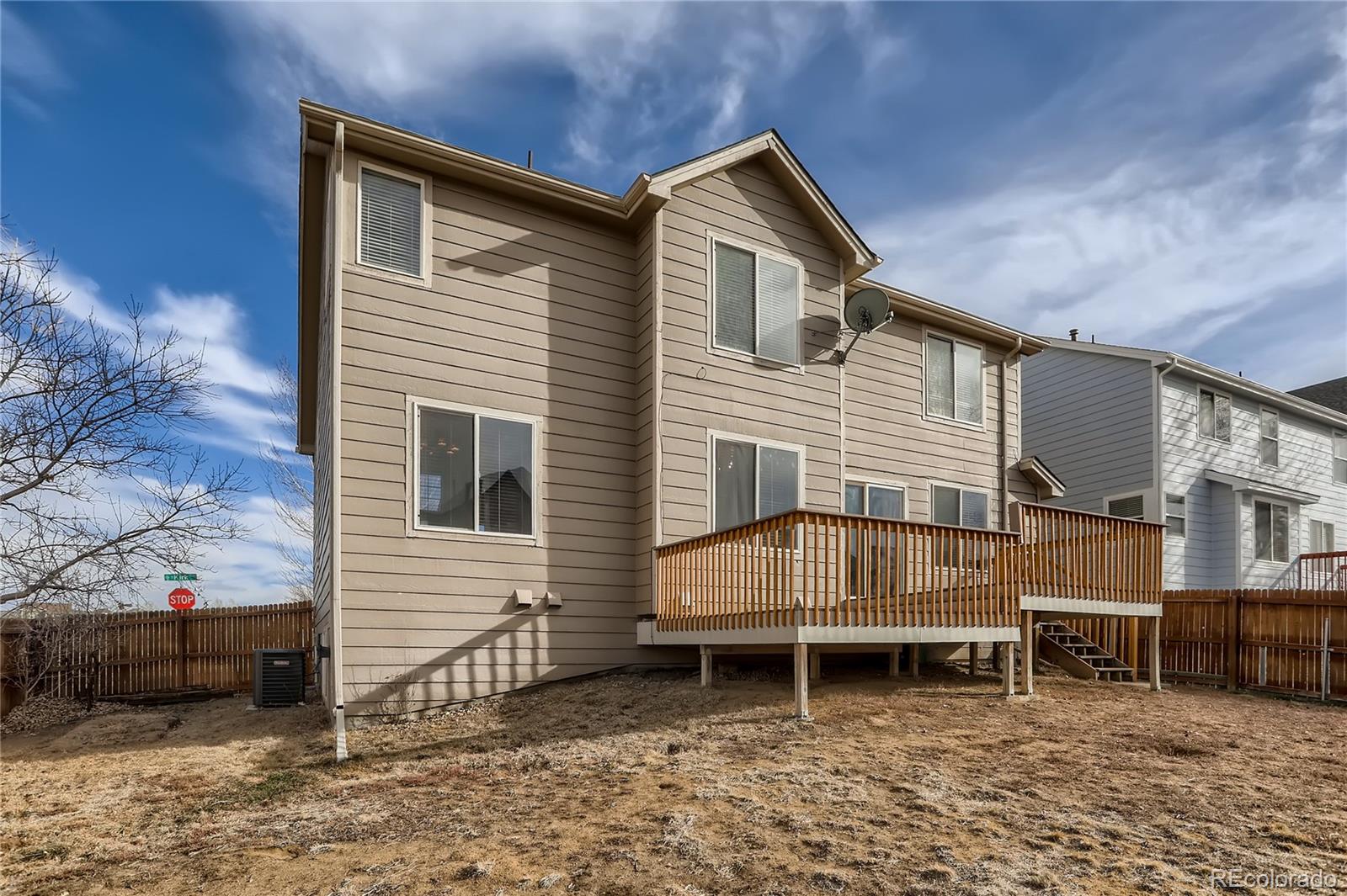 3905 South Kirk Way Aurora, CO 80013 - Photo 32 of 33 a view of a house with a yard