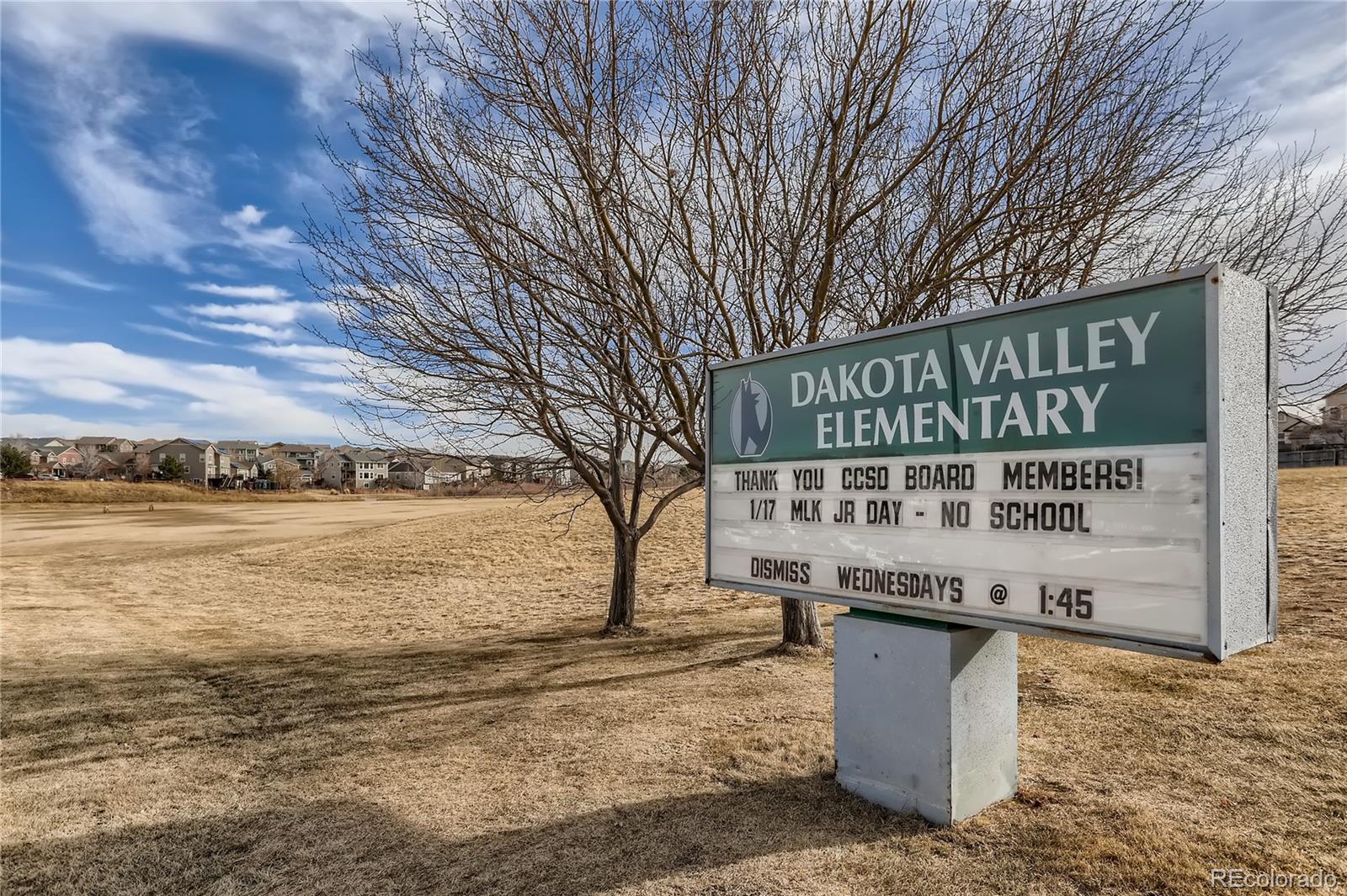 3905 South Kirk Way Aurora, CO 80013 - Photo 33 of 33 a sign on the side of a building