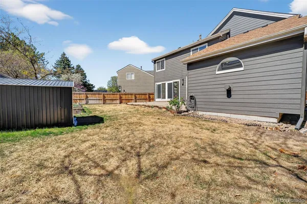 a view of a backyard of the house