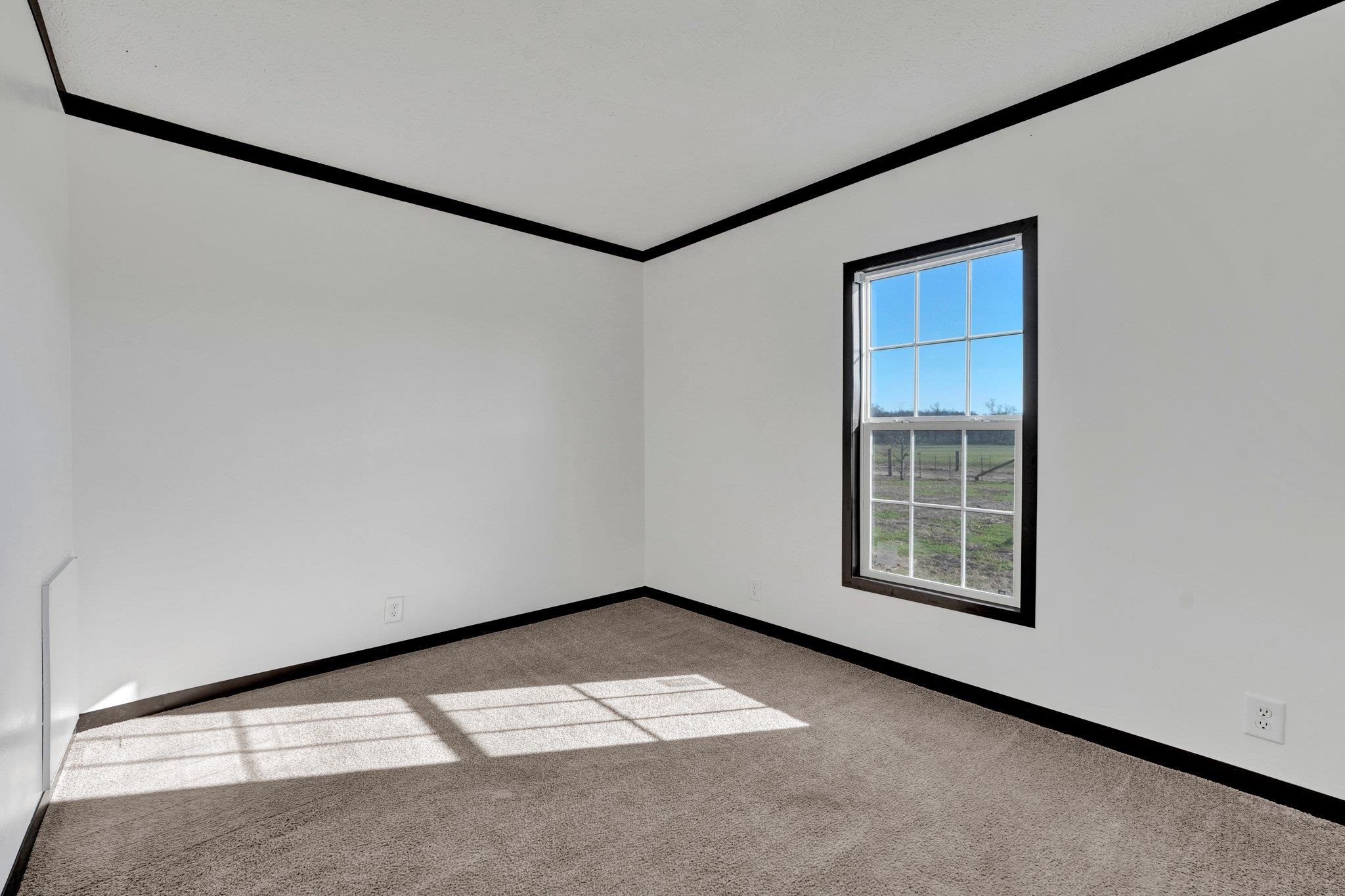 826 Nelson Road Brighton, TN 38011 - Photo 25 of 38 Carpeted spare room with ornamental molding