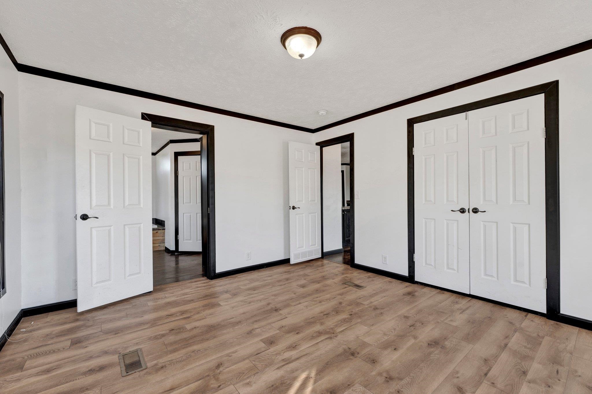 826 Nelson Road Brighton, TN 38011 - Photo 29 of 38 Unfurnished bedroom featuring crown molding and light hardwood / wood-style flooring