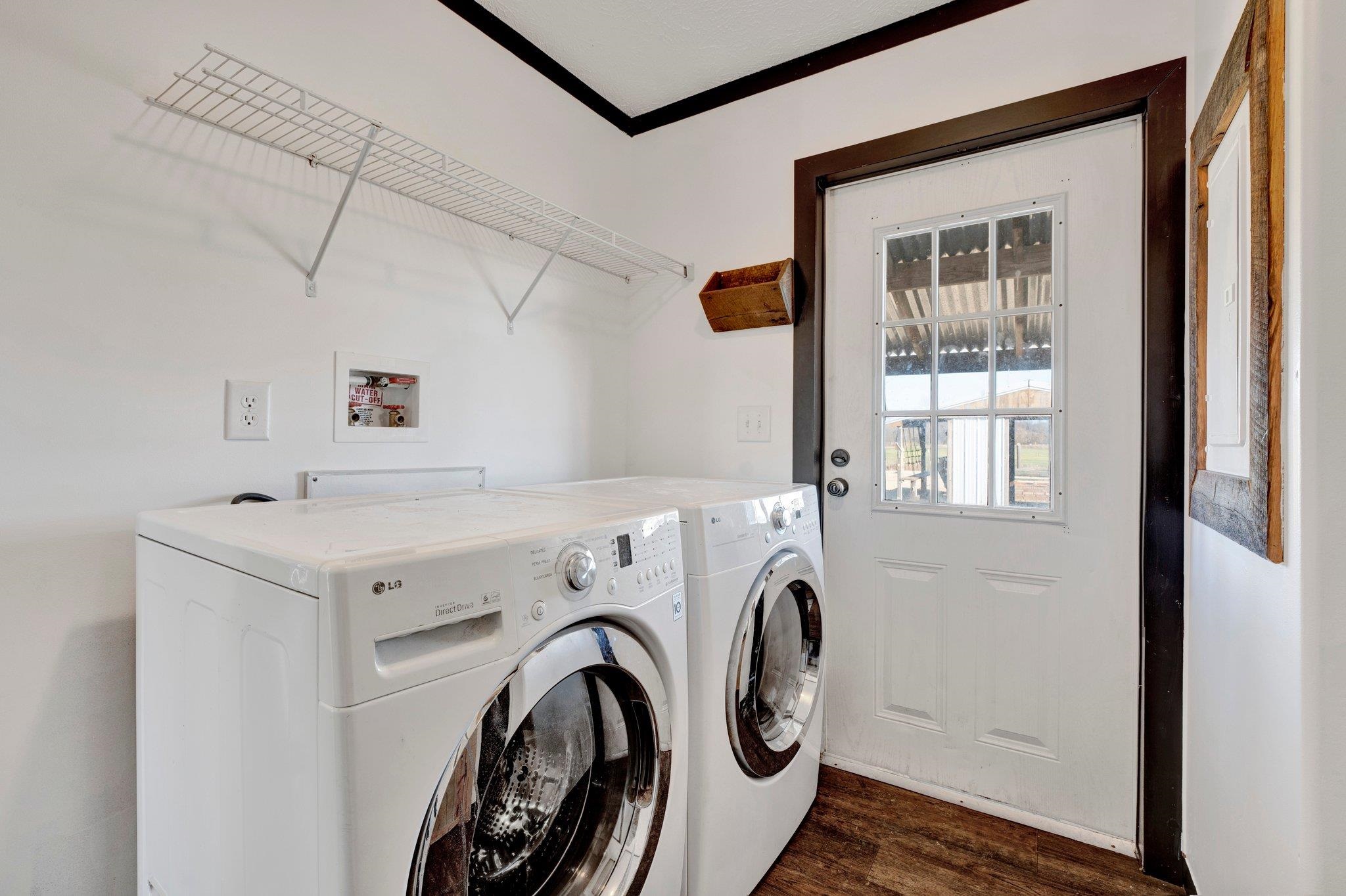 826 Nelson Road Brighton, TN 38011 - Photo 33 of 38 Laundry area featuring washer and dryer, dark hardwood / wood-style flooring, and crown molding