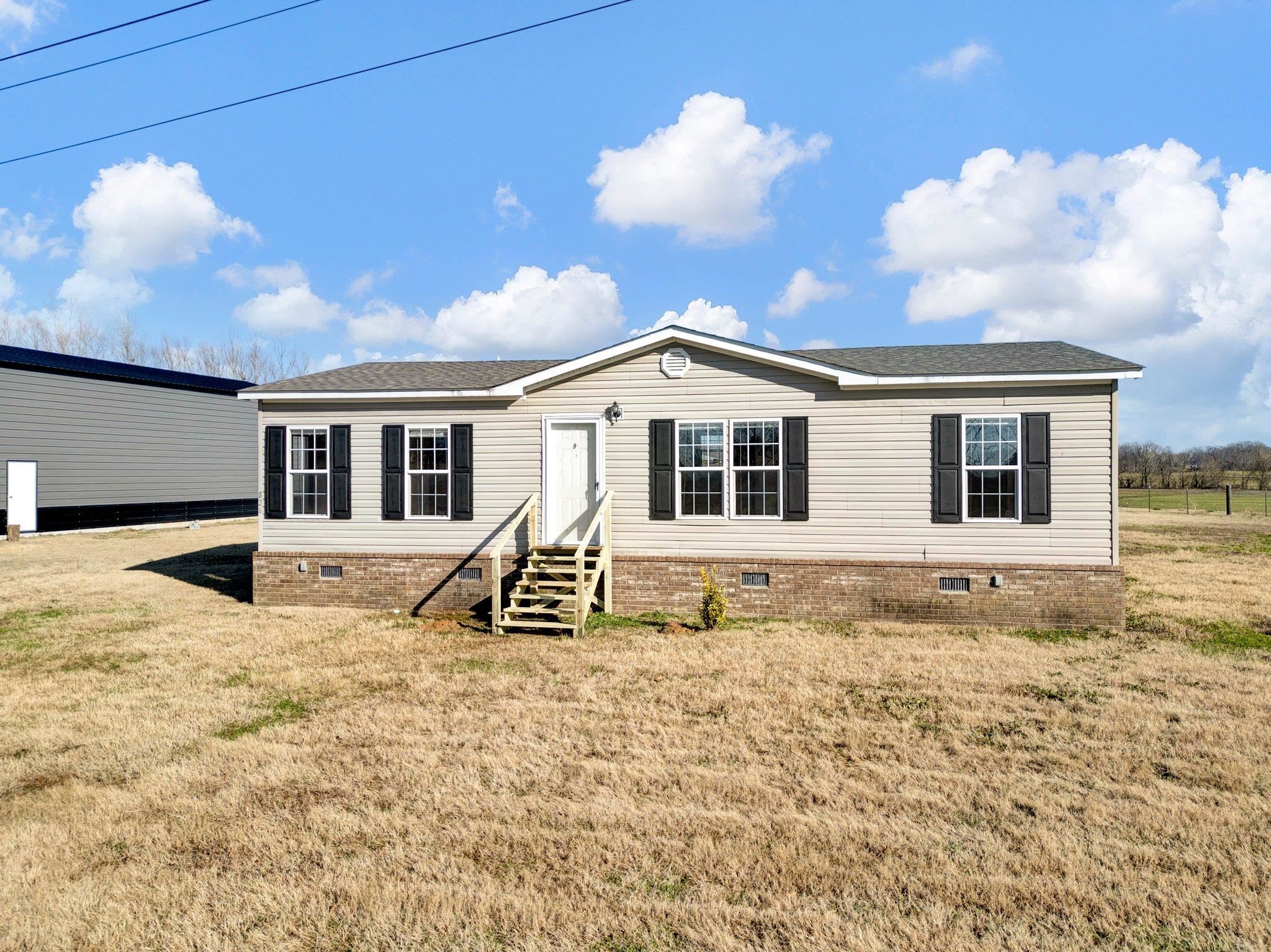 826 Nelson Road Brighton, TN 38011 - Photo 4 of 38 Manufactured / mobile home featuring a front lawn