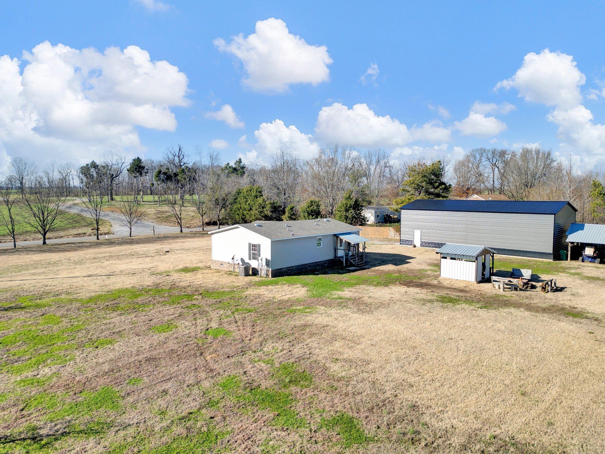 826 Nelson Road Brighton, TN 38011 - Photo 8 of 38 View of yard with a rural view and a storage shed
