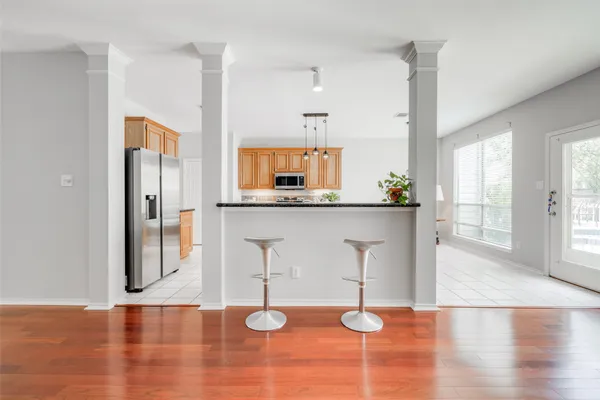 a kitchen with stainless steel appliances a sink and a refrigerator
