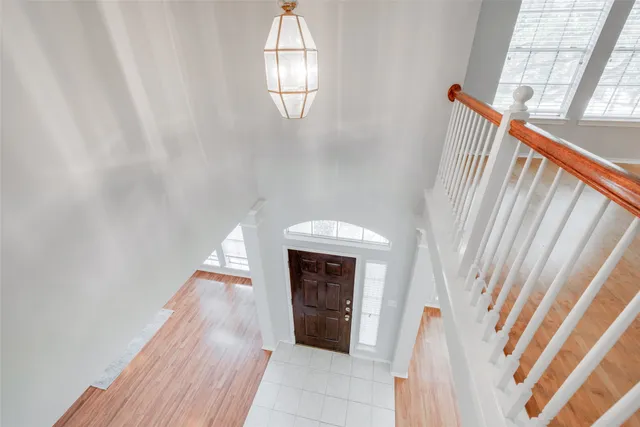 a view of a livingroom with wooden floor and a window