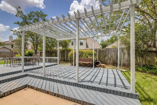 a view of a patio with a table and chairs